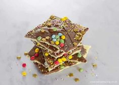 a stack of chocolate and sprinkles on top of each other