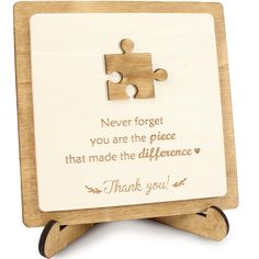 a wooden puzzle frame with a piece missing from it and the words never forget you are the piece that made the difference