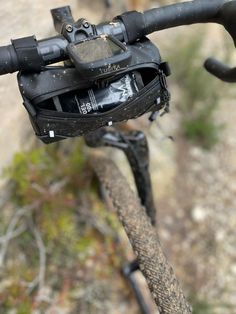 a close up view of the handlebars on a bicycle with a camera attached to it