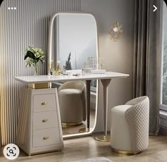 a dressing table with stools and a large mirror in the corner next to a window