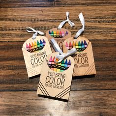 three wooden tags that say you bring color to the world