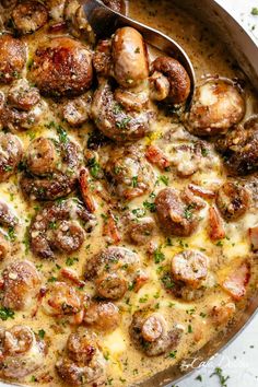 a skillet filled with meatballs and cheese