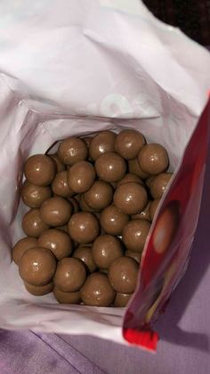 a bag full of chocolate balls sitting on top of a table