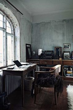 an old fashioned desk in the corner of a room