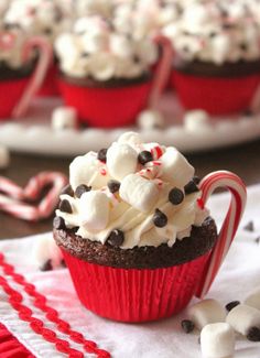 cupcakes with white chocolate and peppermint candy canes on the top