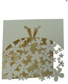 a card with flowers on it in the shape of a turtle, which is cut out from paper