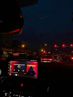 the dashboard of a car at night time