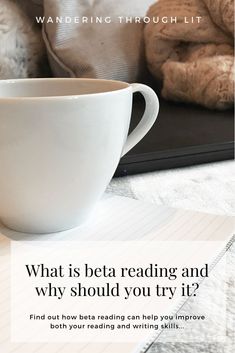 a white coffee cup sitting on top of a table next to a pile of books