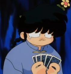 a cartoon character holding cards in his hands