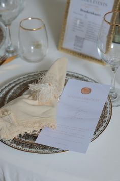 the table is set with an elegant place setting