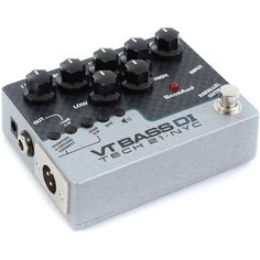 an overdrive pedal with multiple knobs on the front and back buttons, sitting on a white background