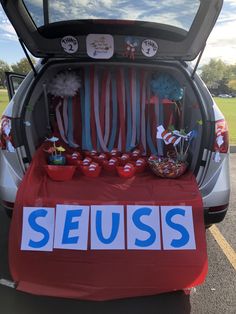 the trunk of a car with seuss written on it's door and decorations