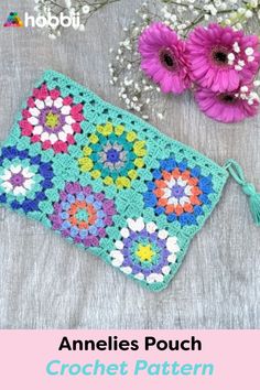 a crocheted pouch with flowers on it