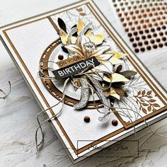 a close up of a birthday card on a table with some scissors and other crafting supplies