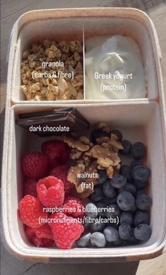 a container filled with granola, yogurt and berries