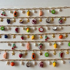 a bunch of charms are hanging on a wall