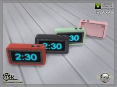 three alarm clocks sitting next to each other