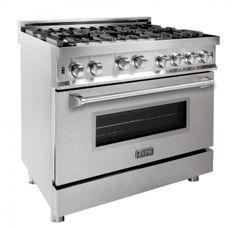 a stainless steel gas range with four burners and two ovens on each side