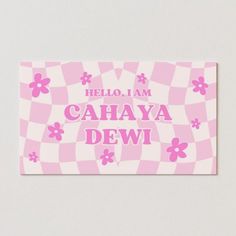 a pink and white checkered business card with the words hello, i am cahaya dew on it