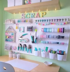 a craft room with pegboard and lots of crafting supplies