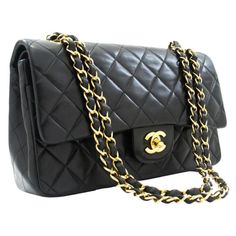 CHANEL Classic Double Flap 10" Chain Shoulder Bag Lambskin Black Pre owned Vintage Black Color Code ID 3412732 Interlocking CC Logo & Quilted Pattern Gold-Tone Hardware Chain-Link Shoulder Straps Single Exterior Pocket Leather Lining & Four Interior Pockets Turn-Lock Closure at Front with CC logo The coveted "Must have" Chanel Timeless 10 inch double flap shoulder bag in Black quilted lambskin leather, gold metal trim, golden metal chain interlaced with beige leather for a shoulder or crossbody carry Patch pocket on the back of the bag Flap closure, golden CC logo clasp Double flap Zip on the bottom flap Patch pocket at front of bag Inner lining in beige leather, 1 double patch pocket, 1 lip liner Signature : "Chanel Paris Made in France” Date: 1988 Dimensions: 23x15x6 cm (10x5,9x2,3 Inche Medium Classic Chanel Bag, Channel Purse, Dream Items, Logo Vintage, Quilted Pattern, Chanel Vintage, Chanel Paris, Classic Flap, Cc Logo