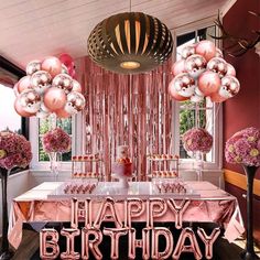 a birthday party with pink and gold decorations