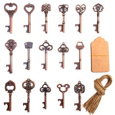 an assortment of antique keys with tags attached to them