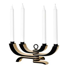 a candelabra with five white candles in it