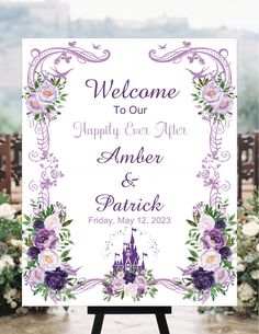 a welcome sign with purple flowers and a castle in the background on a easel