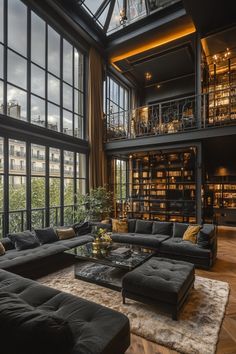 a living room filled with furniture and lots of windows