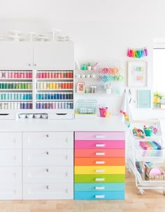 a room filled with lots of different colored drawers