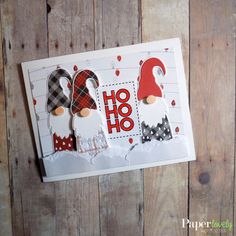 a card with two gnomes on it and the words ho hoo in red