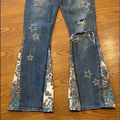 One-Of-A-Kind Earth-Friendly Sustainable All Sizes Available Free Custom Orders My Jeans Or Yours Free Shipping The Jeans Pictured Here Are All Available. If They Are Not Your Size, No Worries. I Can Quickly Make A Similar Pair In Just A Few Days. I'm Very Quick. I Do Not Charge Extra For Custom Work. What Makes My Sweetsuezen Jeans Unique The Beautiful Patches That I Use. I Use Textiles From Around The World. Some Patches Are Made From Upcycled Indian Saris Which Are Embroidered And Some Have A Bit Of Sparkle. All The Materials I Use Are Upcycled And Ethically Sourced. I'd Love To Make A Pair Of Jeans Made Especially For You. I Usually Start With Pre-Owned Jeans I Can Search Patched Flare Jeans, Bohemian Jeans With Patches For Festival, Back Star Patchwork Flare Jeans, Embroidered Flared Jeans, Hippie Denim Bottoms With Patches, Patch Jeans, Unique Jeans, Patchwork Jeans, Lucky Brand Jeans