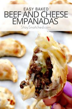 a hand holding up a piece of beef and cheese empanadas