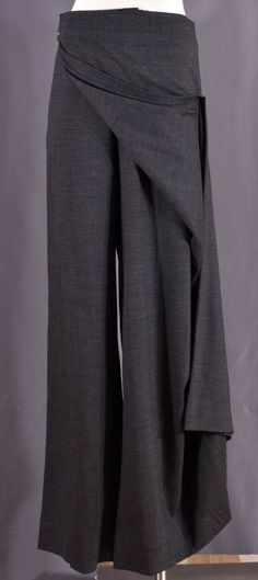 Vintage Authentic JEAN PAUL GAULTIER Gray Wool Wrap Skirt Apron Women's Pants Trousers IT 48 US 14 RARE to Find!!! Absolutely in Excellent Condition  measurements are :  the length: 44 " the inseam: 34" the waist flat: 19.5"  100% Made in italy FREE SHIPPING!! #######################################################   Merchant_info guarantees that all watches and brand name items is 100% authentic and original. We have years of experience in selling watches and collector's item all over the world Fantasy Clothing Pants, Fitted Wide Leg Culottes For Office, Fitted Culottes For Workwear, Chic Fitted Culottes For Fall, Fantasy Pants Pattern, Fall Fitted Wide Leg Culottes, Fall Wide Leg Fitted Culottes, Elegant Wide-leg Pants For Winter, Vintage Corset Pants