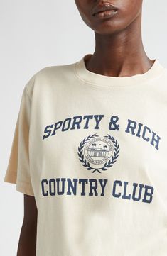 Make your way around the country club like you own it in a cotton-jersey T-shirt emblazoned with a brand crest. Crewneck Short sleeves 100% cotton Machine wash, dry flat Made in the USA Asian & Pacific Islander Owned/Founded Classic Sports Tops With Letter Print, Sports Merch, Sporty Crew Neck T-shirt With Logo, Sporty And Rich Athletic Club, Sporty T-shirt With Embroidered Logo, Sporty Cotton T-shirt With Embroidered Graphics, Sporty Relaxed Fit T-shirt With Embroidered Logo, Sporty And Rich, Team Apparel