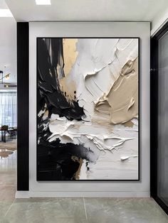 an abstract painting hangs on the wall next to a door in a modern office space