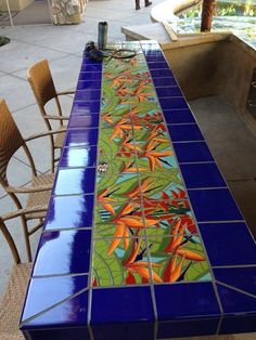 a long table with blue and green tiles on it