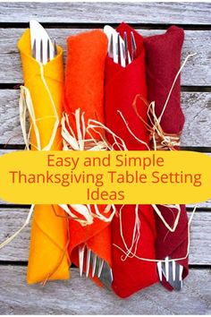 thanksgiving table setting with colorful napkins and silverware on wooden background text overlay says easy and simple thanksgiving table setting ideas