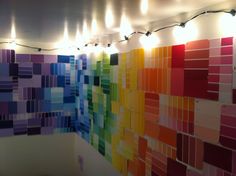 a colorful wall with lights hanging from it