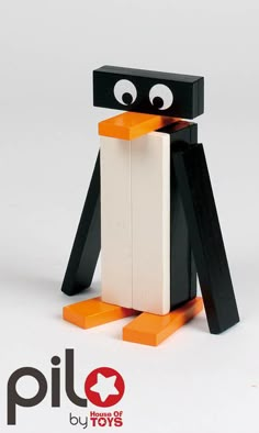 a black and white penguin made out of lego blocks