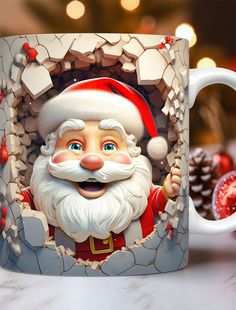 a coffee mug with a santa clause on it and some pine cones in the background