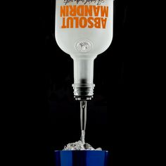 a glass being filled with ice in front of a black background that says wynnykny moscow