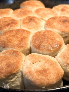 a pan filled with biscuits sitting on top of a stove