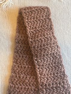 Crochet Children's scarf made with 100% wool yarn.  One size fits most. Warm Cozy Scarves One Size, One Size Yarn Scarves For Cold Weather, Knitted Scarves For Cold Weather In Fall, Yarn Scarves For Cold Weather, Handmade Alpaca Scarves For Fall, Cold Weather Yarn Scarves, Brown Knitted Scarves For Fall, Acrylic Yarn Scarf For Cold Weather, Casual Winter Scarves In Wool