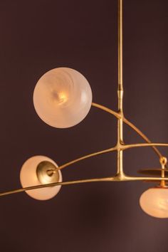 a chandelier with five lights hanging from it's sides and two on each side