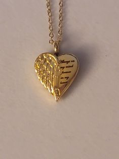 Gold Heart with Angel Wing Cremation Urn says Always On My Mind, Forever In My Heart.  Necklace comes with everything needed to help you get the ashes into the urn.  ** We also have this necklace available in silver.  Heart urn is stainless steel and comes on a 20inch gold stainless steel chain.  To personalize this necklace please check out our "ADD On" section.  Simply go to the search bar on our shop's homepage.   Once there type "Add On" into the search bat.  If you find anything you like you can add it to your cart along with this necklace.   Once everything is in your cart you can select "purchase" to make your purchase.  Please feel free to message us with any questions you may have.   We would be happy to help you.  Thank you so much. Meaningful Heart-shaped Keepsake Necklace, Personalized Heart Shaped Spiritual Necklace, Personalized Heart-shaped Spiritual Necklace, Inspirational Gold Heart Jewelry, Inspirational Heart-shaped Gold Jewelry, Personalized Heart Charm Necklace For Memorial, Heart Shaped Necklaces For Valentine's Day Commemoration, Heart-shaped Necklaces For Valentine's Day Commemoration, Heart-shaped Necklace For Valentine's Day Commemoration