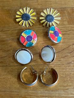 Four pairs of earrings, all very different and fun! Item 2600 Please note: This item is vintage, meaning it is 20+ years old. It was likely used. It may not be perfect.  The pictures show size compared to a quarter and a dime.  I offer a variety of items. I research every item I sell and the information I provide is accurate to the best of my knowledge. I cannot, however, be an expert on everything. All items may show slight to normal wear from age. Arkansas City, Circular Earrings, Wedding Jewelry Earrings, A Plus, 20 Years Old, Wedding Earrings, 20 Years, Wedding Jewelry, Etsy Accessories