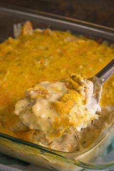 a casserole dish with chicken and cheese in it