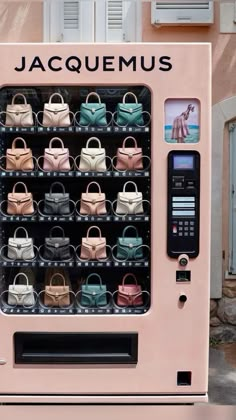 a pink vending machine with many purses on it